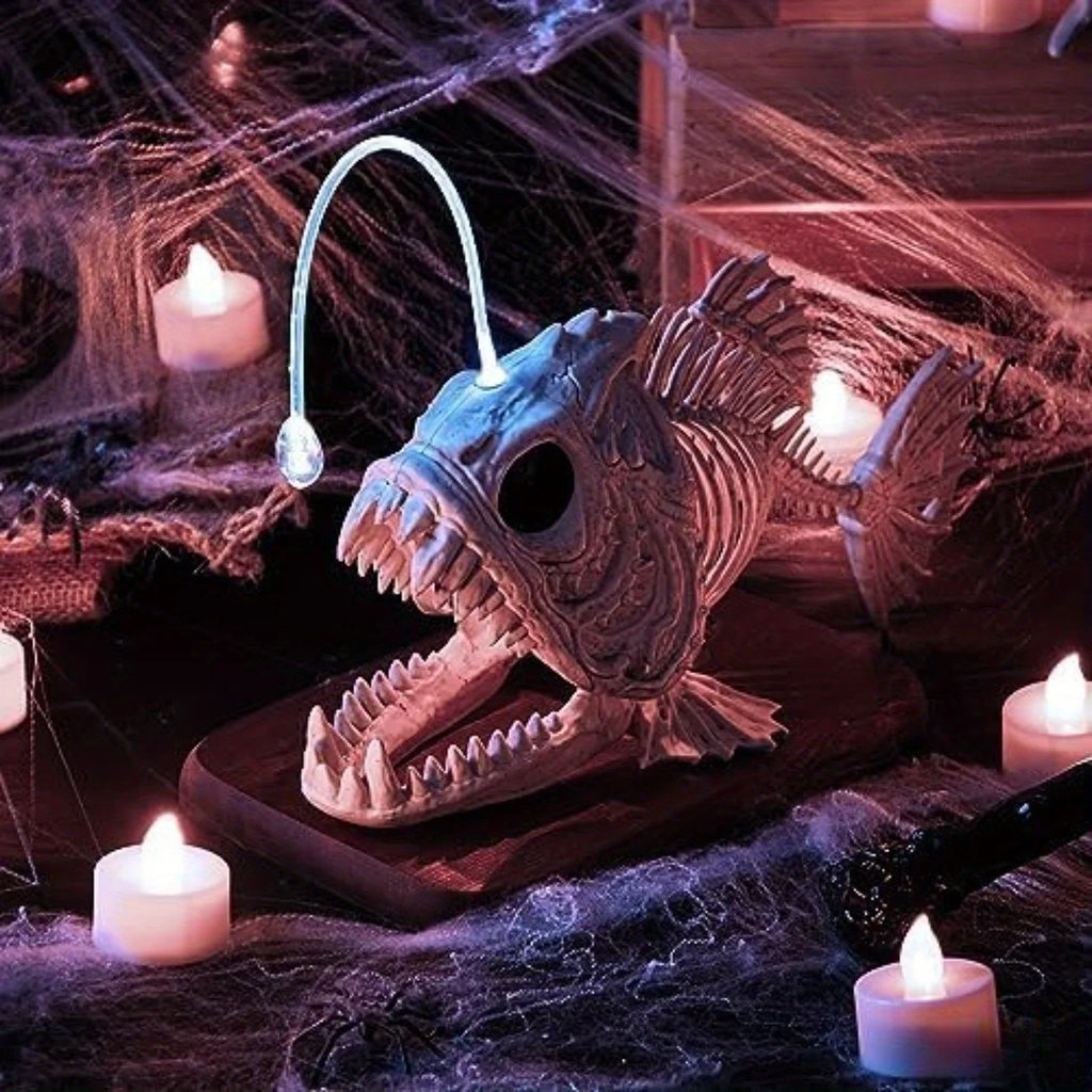 Angler fish skeleton decoration in a spooky Halloween scene with spider webs