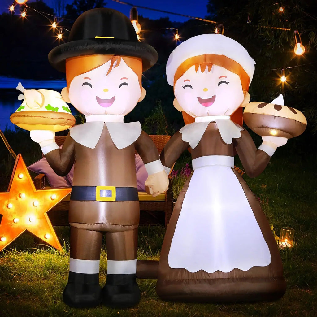 6 ft pilgrim couple inflatable lit up in a backyard with string lights