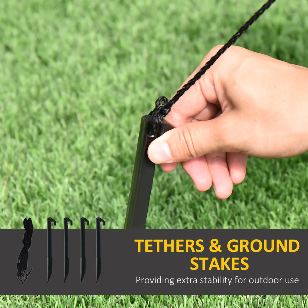 Ground stakes and tether anchoring a turkey yard inflatable on grass