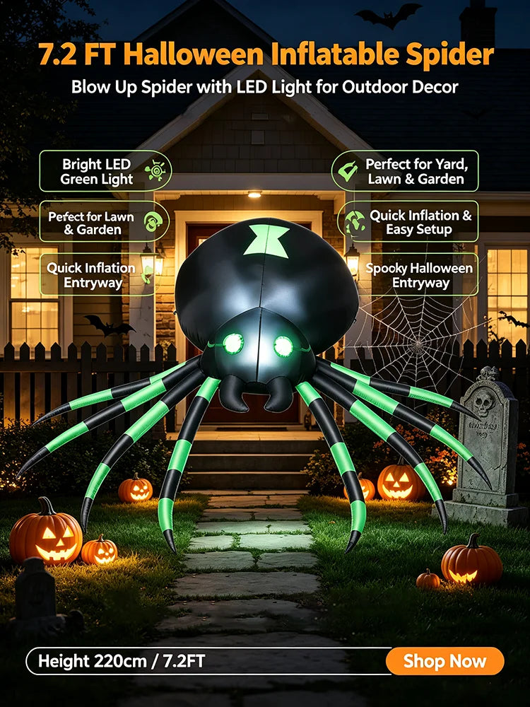 Halloween inflatable spider in front of a house entryway with a spider web and tombstone