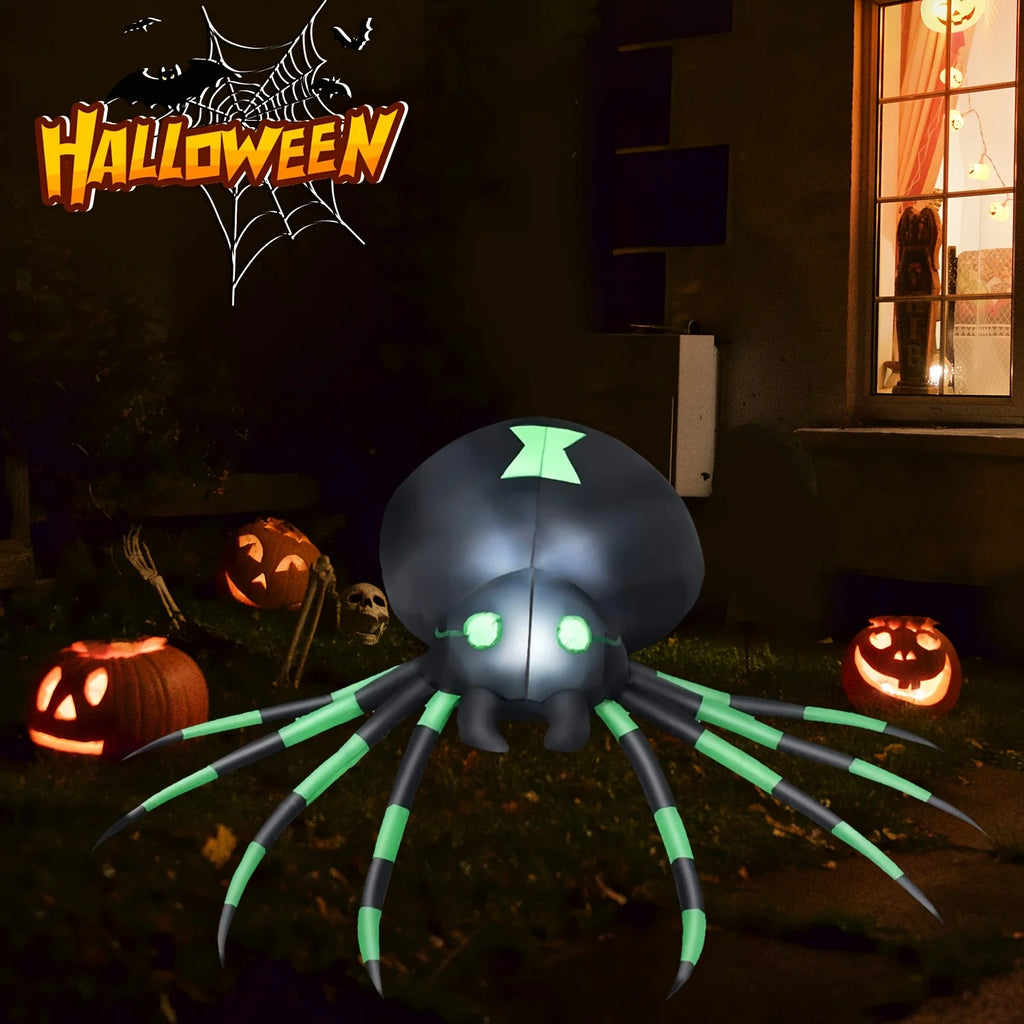 Glowing blow up spider in a dark Halloween yard with pumpkins and a skull