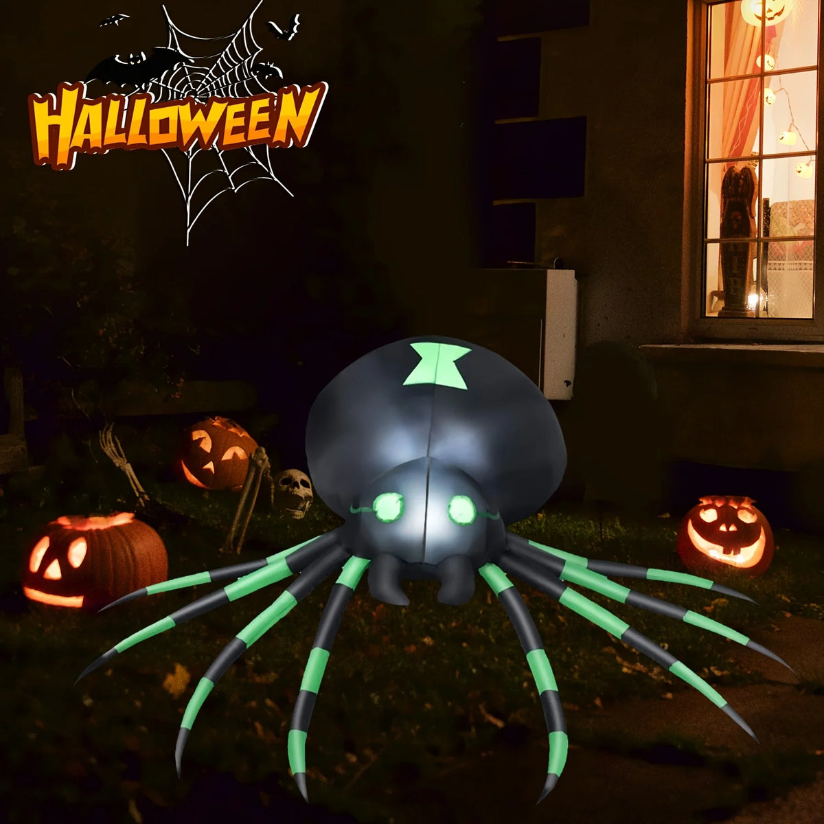 Glowing blow up spider in a dark Halloween yard with pumpkins and a skull