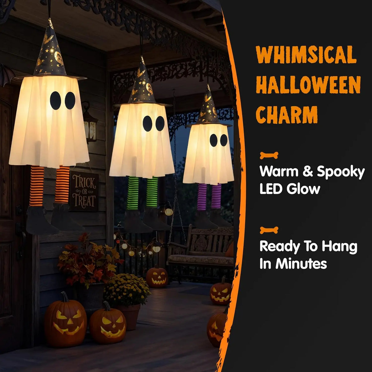 Light-up witch hat ghosts hanging on a porch with jack-o'-lanterns
