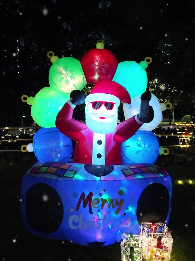 Real night photo of the DJ Santa inflatable glowing in a yard